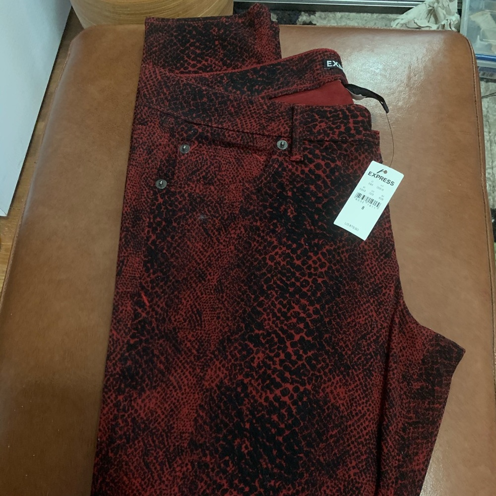 Red snakeskin express jeans